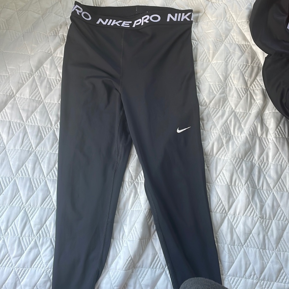 Nike Pro leggings, Black, solid, Mesh on back of calf.